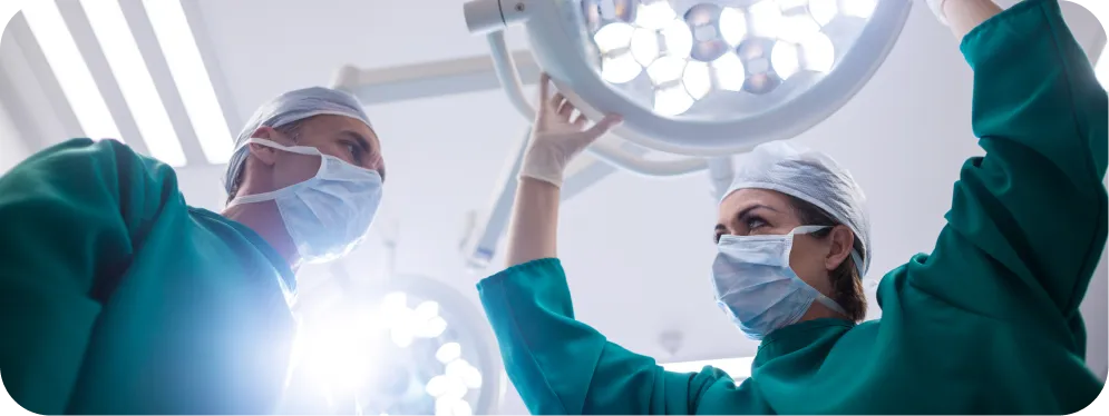 Orthopedic surgeons preparing for knee surgery while assessing whether a meniscus tear is repairable or requires removal