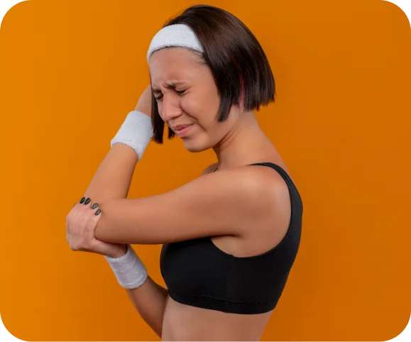 Person holding the outer part of the elbow due to pain from chronic lateral epicondylitis (tennis elbow)