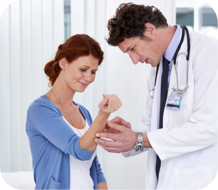 Orthopedic doctor examining a woman with medial elbow pain during evaluation for chronic medial epicondylitis