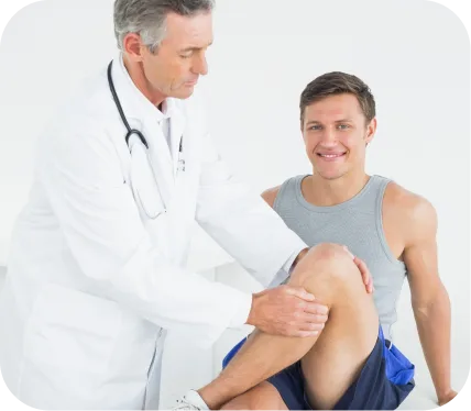 Orthopedic specialist examining a patient’s knee during evaluation for a patellar or quadriceps tendon rupture