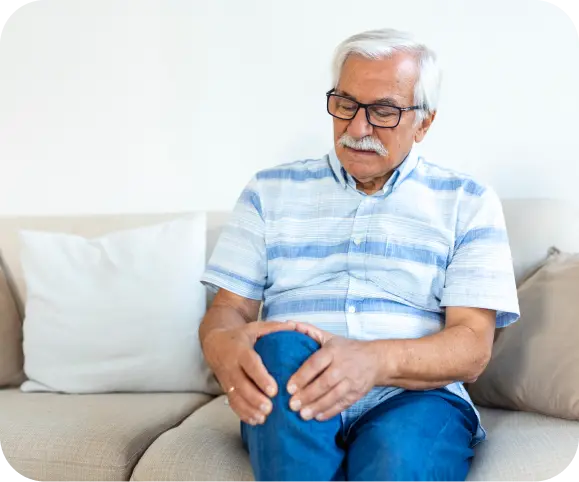 Man holding his knee due to meniscus tear pain, illustrating symptoms of meniscus injury.