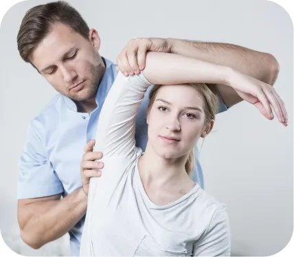 Orthopedic specialist examining a patient’s shoulder to diagnose biceps tendon medial subluxation or dislocation