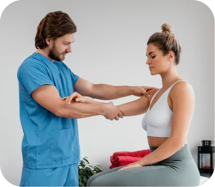 Orthopedic specialist assessing a patient’s shoulder stability during evaluation for Bankart, ALPSA, or HAGL lesions