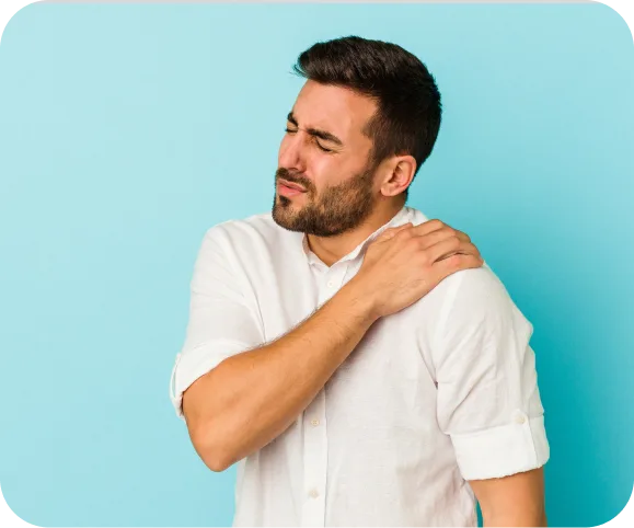 Man holding his painful shoulder, illustrating common symptoms of a posterior shoulder labral tear and instability